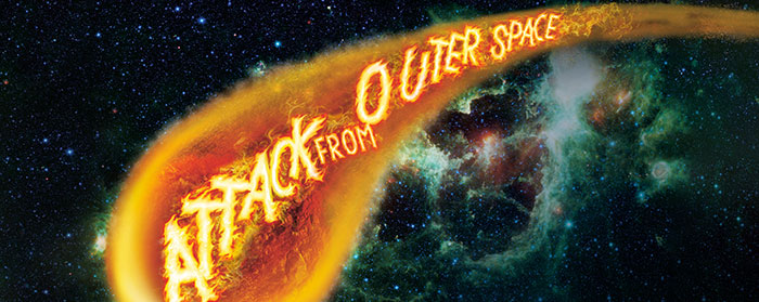 Attack from Outer Space written in flames in a meteor flying through outer space