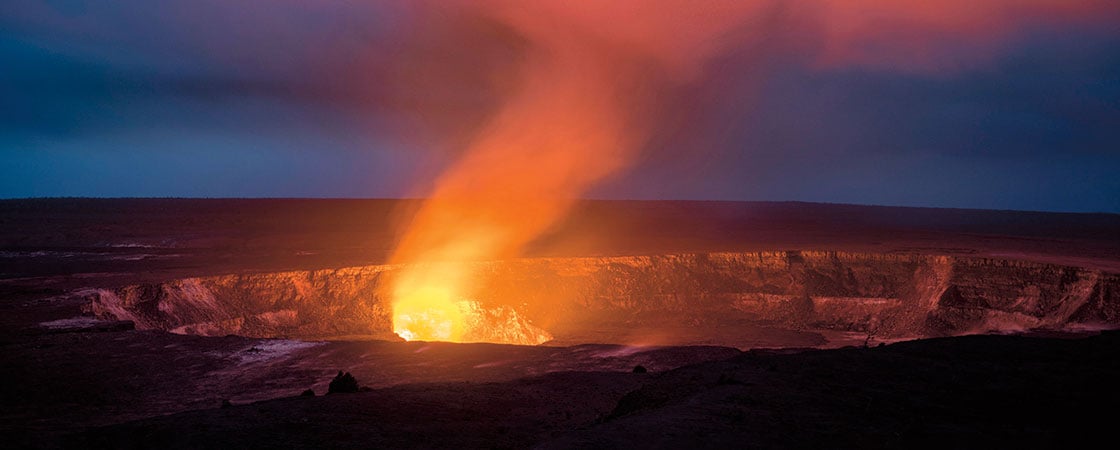 Smoke and lava bubbling in a volcano