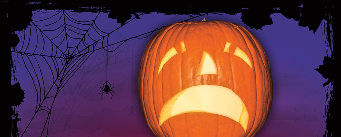 Sad Jack-o&apos;-lantern against a purple and black background with a spider and its web